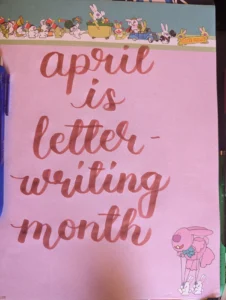 April is letter writing month text on pink sheet