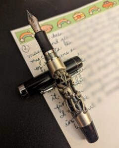 Closeup shot of pen with art carving on the display